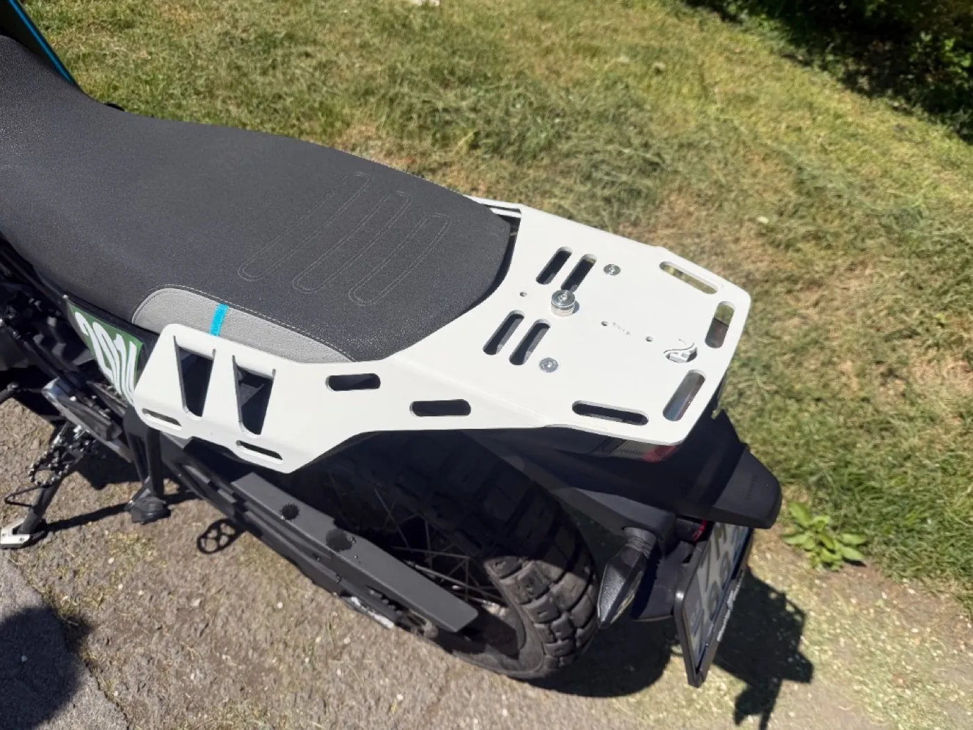 CF Moto 800MT-X rack — real world detail shot, muddy conditions
